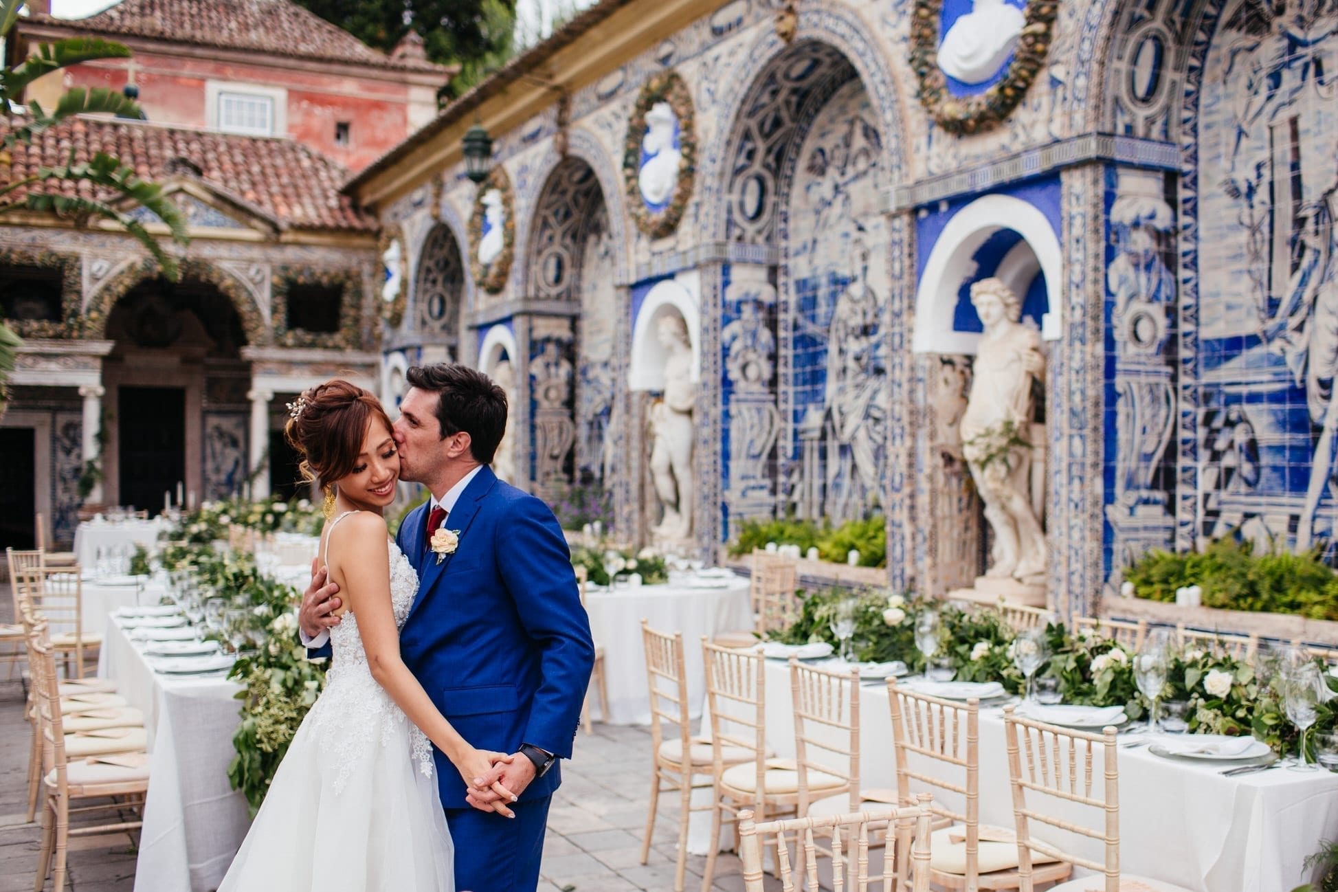 Bride and groom kiss on their wedding in Fronteira Palace, in Lisbon, Portugal