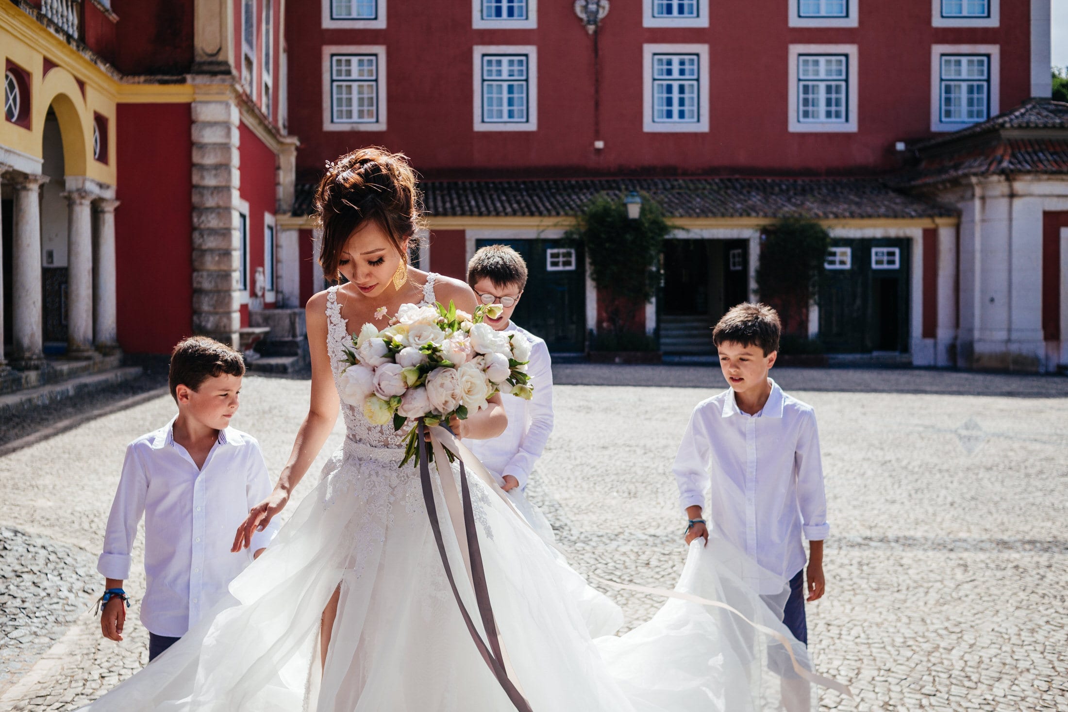 the bride prepares to enter the ceremony at her wedding in fronteira palace in Lisbon, Portugal