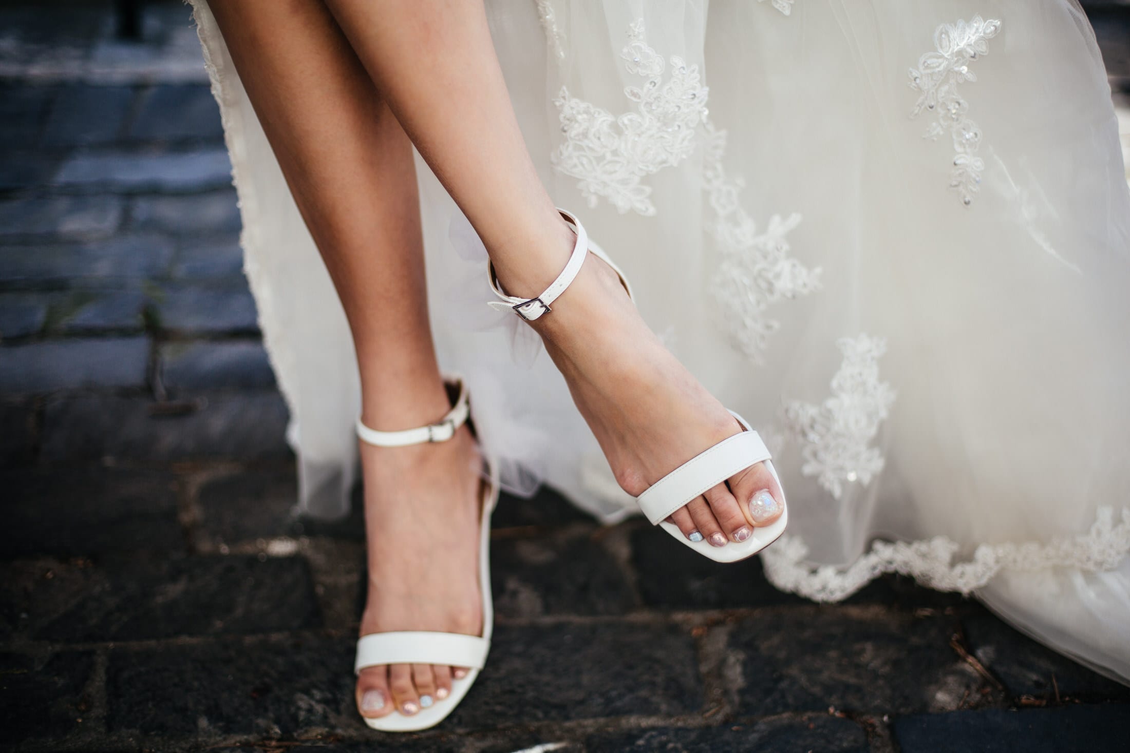 a detail of the bride's wedding shoes