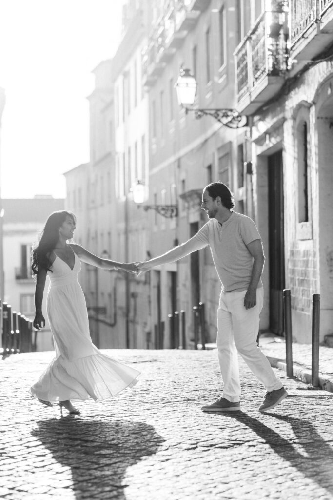a couple dancing in a little alley in Lisbon