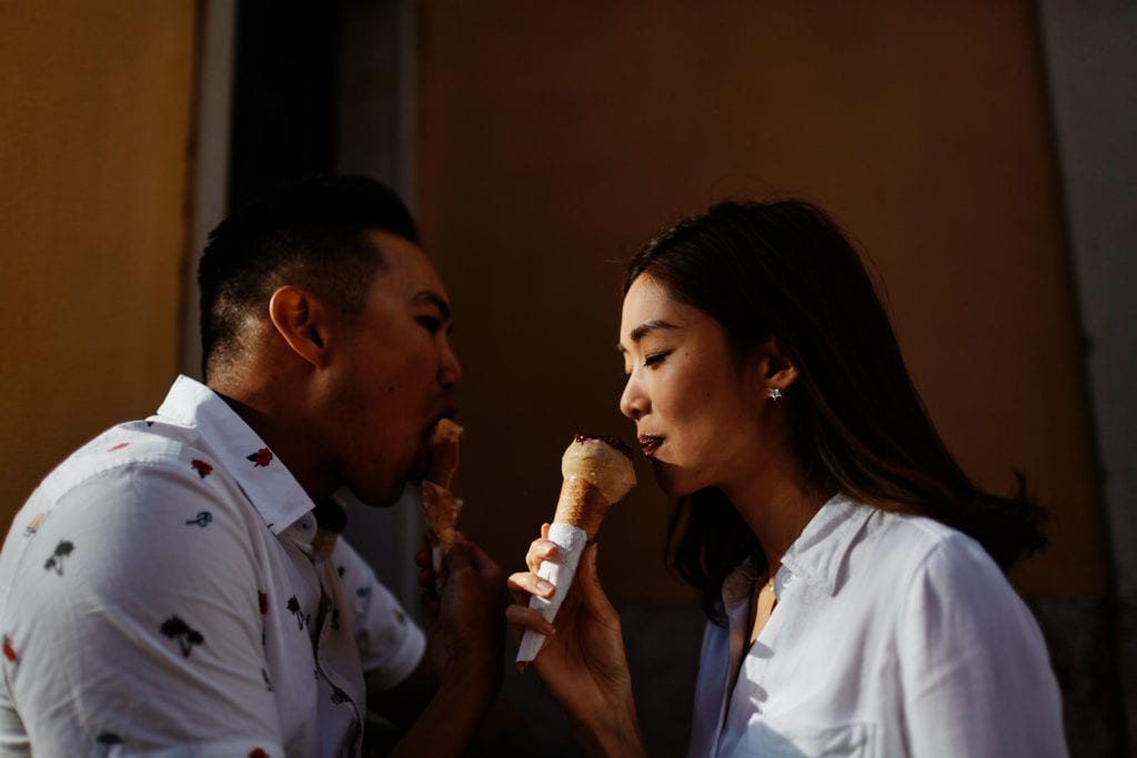 Eliza Sam and her husband Joshua Ngo eat an ice cream in Lisbon