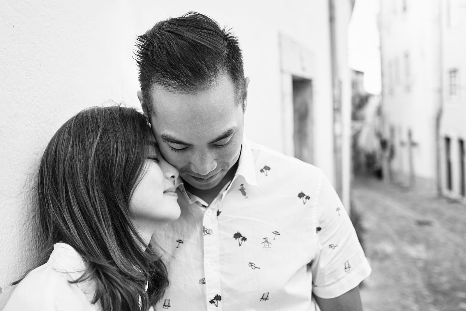 Eliza Sam and Joshua Ngo in a romantic pose in the Alfama neighbourhood in Lisbon